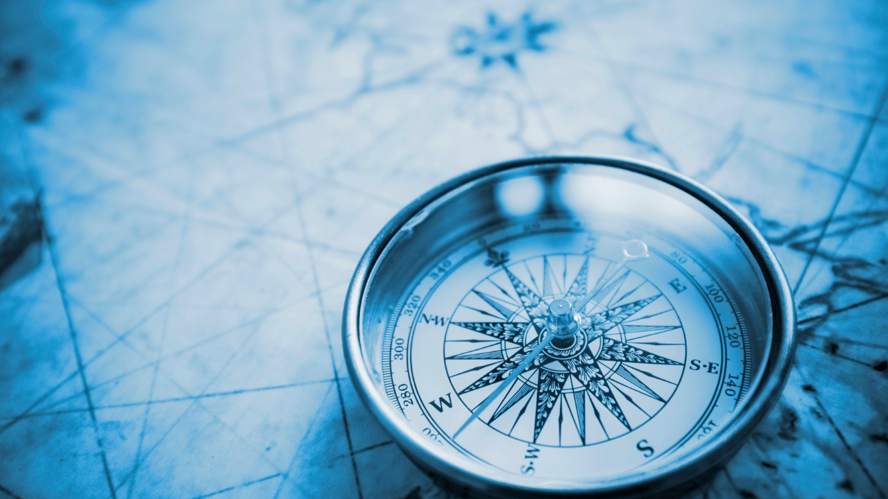 An AI generated image of a blueprint and compass.